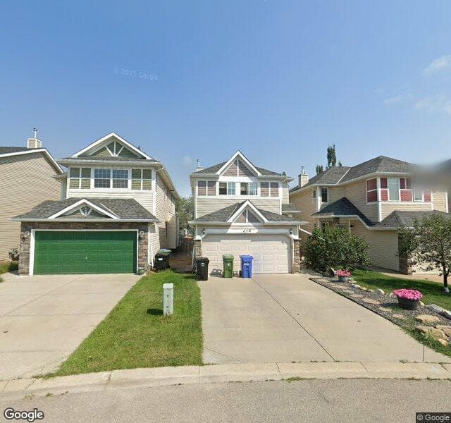 Street view of 218 Cougar Plateau Mews SW, Calgary