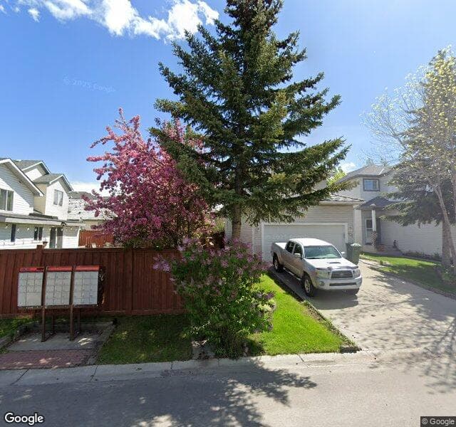 Street view of 402 Mount Apex Green SE, Calgary