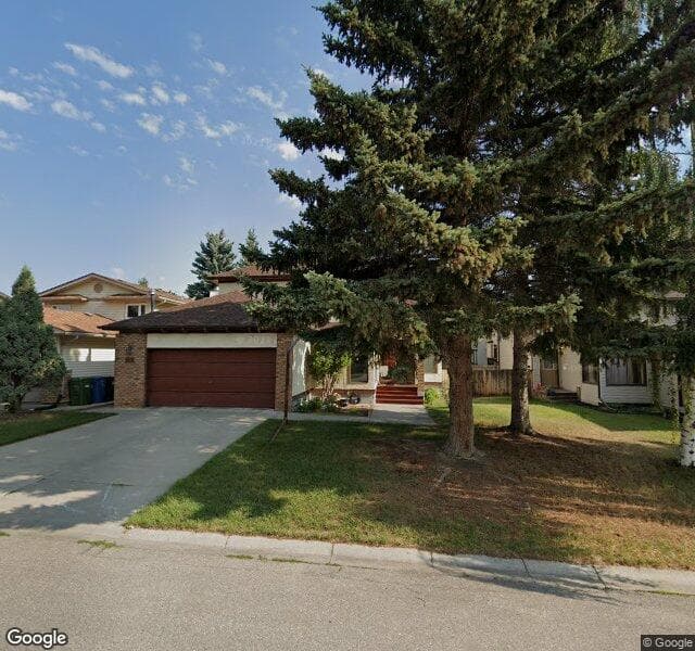 Street view of 71 Woodstock Way SW, Calgary