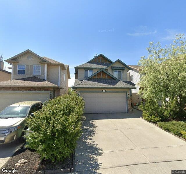 Street view of 80 Cougarstone Square SW, Calgary
