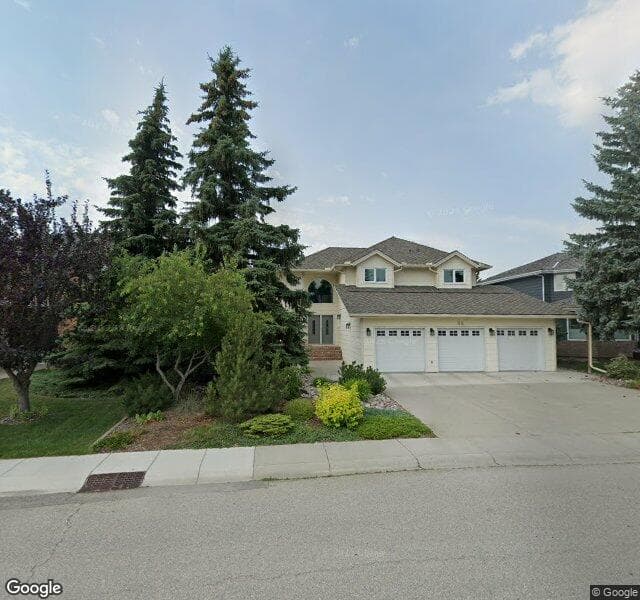 Street view of 96 Woodhaven Crescent SW, Calgary