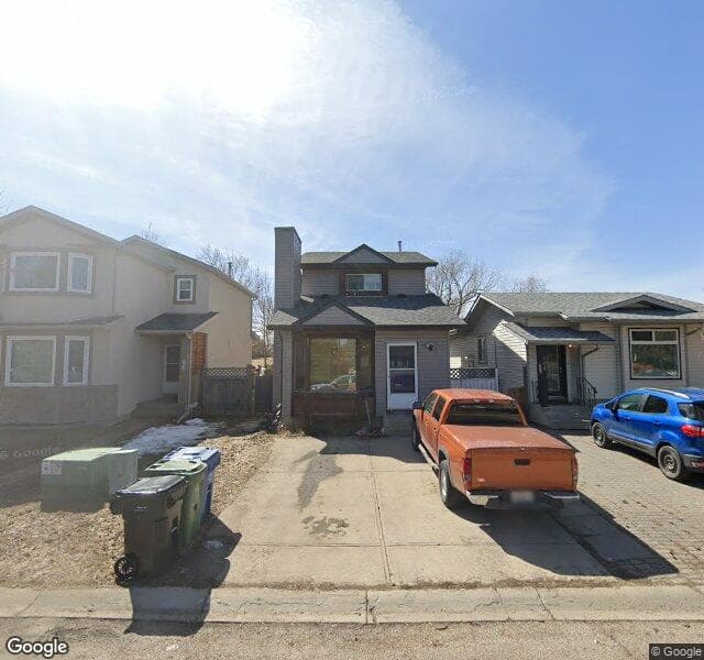 Street view of 100 Riverbrook Way SE, Calgary