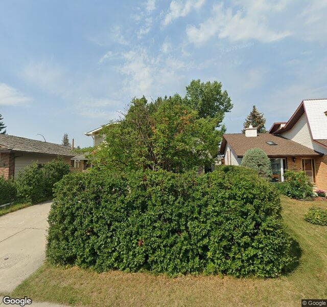 Street view of 131 Woodmont Drive SW, Calgary