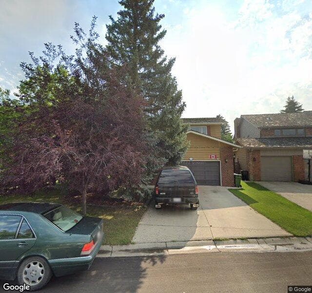 Street view of 100 Woodgate Close SW, Calgary