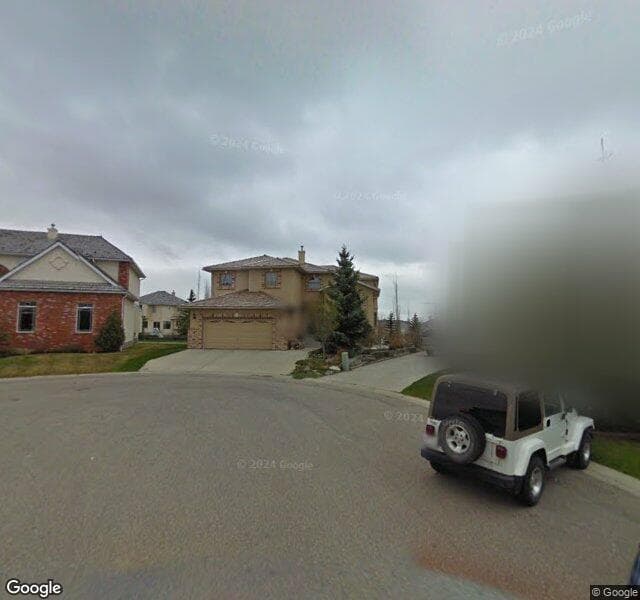 Street view of 115 Patina Green SW, Calgary