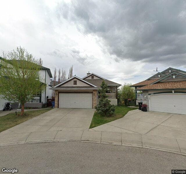Street view of 446 Rocky Ridge Cove NW, Calgary