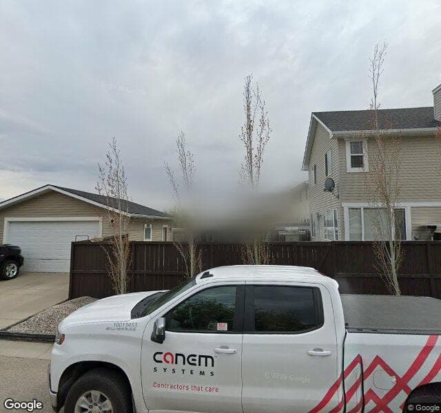 Street view of 1097 Bridlemeadows Manor SW, Calgary