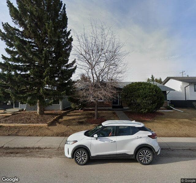 Street view of 1035 Lake Bonavista Drive SE, Calgary
