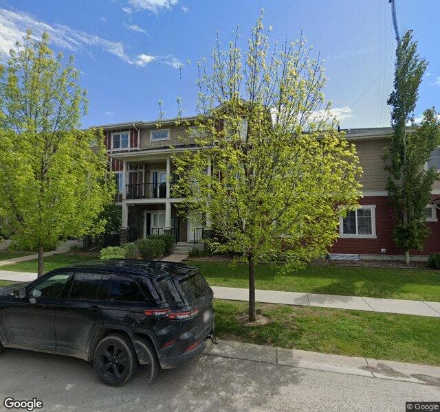 Street view of 6-51 W Coach Manor SW, Calgary
