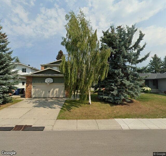 Street view of 24 Woodmont Drive SW, Calgary