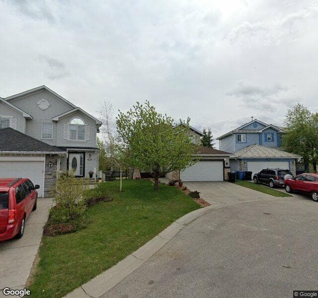 Street view of 149 Rocky Ridge Cove NW, Calgary