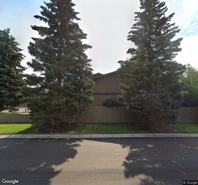 Street view of 4 Woodgrove Crescent SW, Calgary