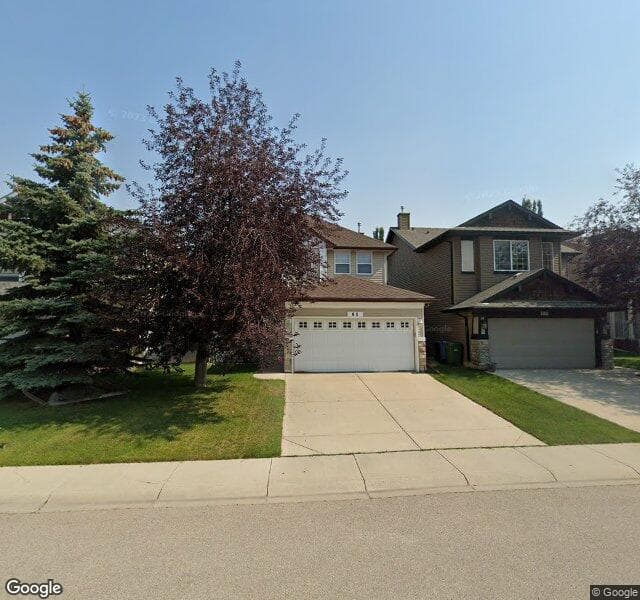 Street view of 60 Cougarstone Villas SW, Calgary