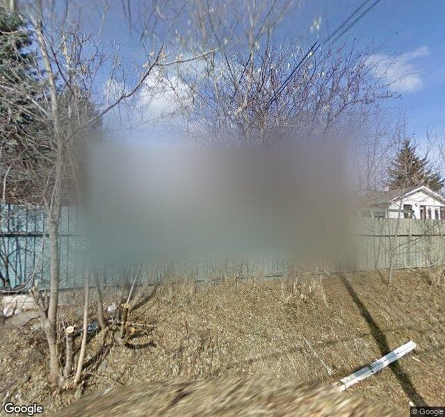 Street view of 48 Woodlark Drive SW, Calgary