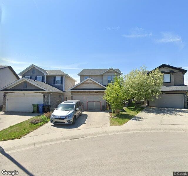 Street view of 96 Cougarstone Square SW, Calgary