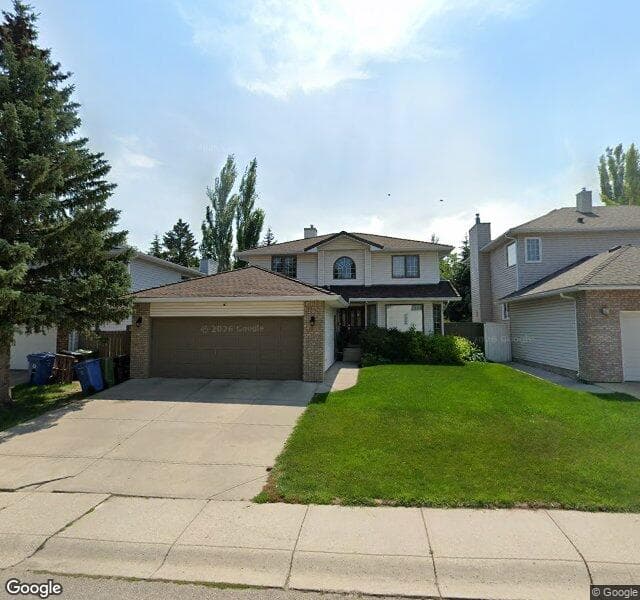 Street view of 148 Woodstock Way SW, Calgary