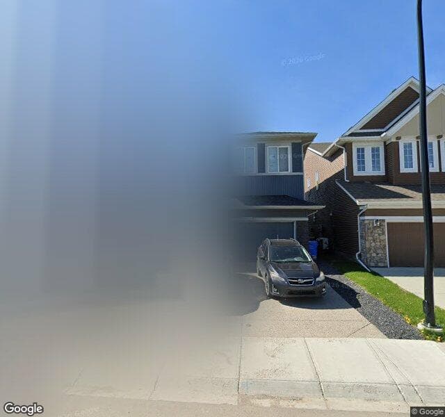 Street view of 61 Creekside Avenue SW, Calgary
