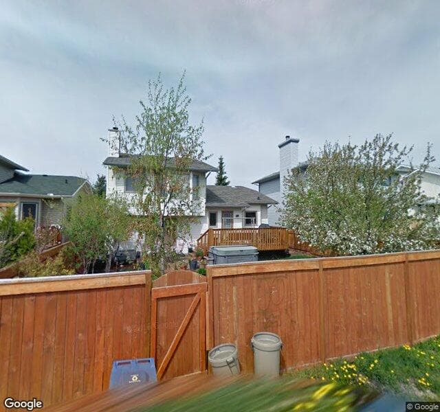 Street view of 116 Woodmark Crescent SW, Calgary