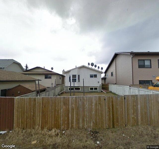Street view of 6910 26 Avenue NE, Calgary