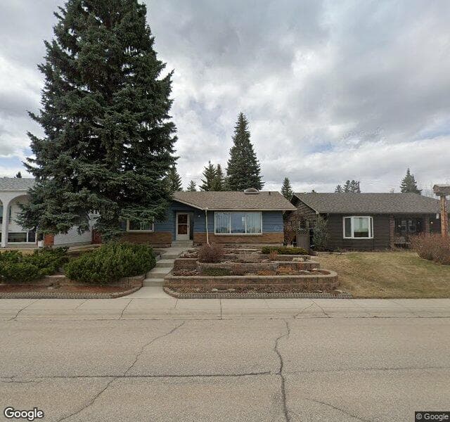 Street view of 1411 Lake Bonavista Drive SE, Calgary