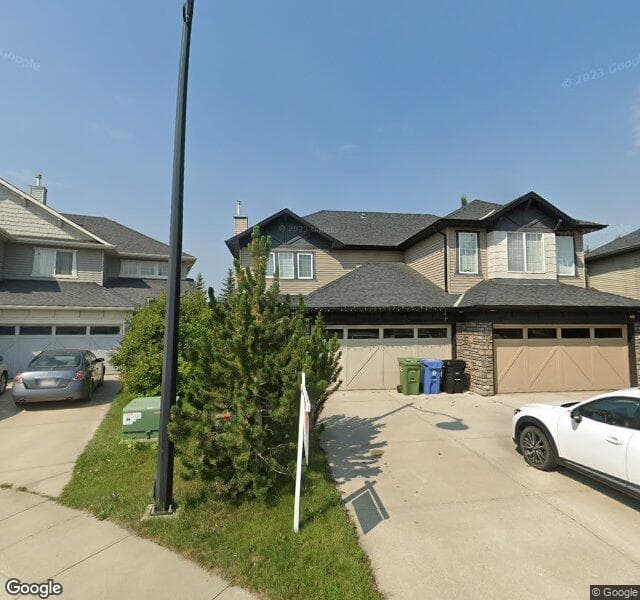 Street view of 25 Cougarstone Place SW, Calgary