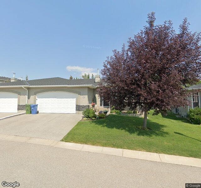 Street view of 64 Elysian Crescent SW, Calgary