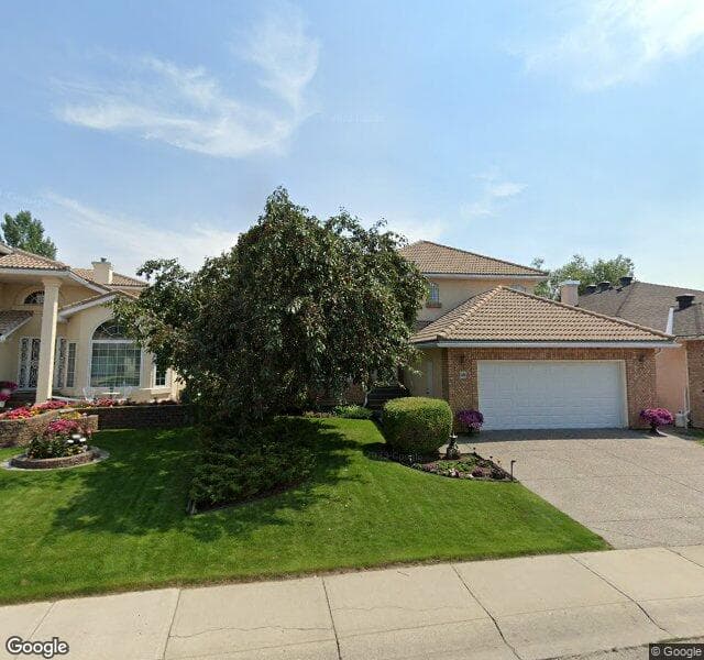 Street view of 48 Woodpark Close SW, Calgary