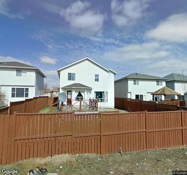 Street view of 1030 Harvest Hills Drive NE, Calgary