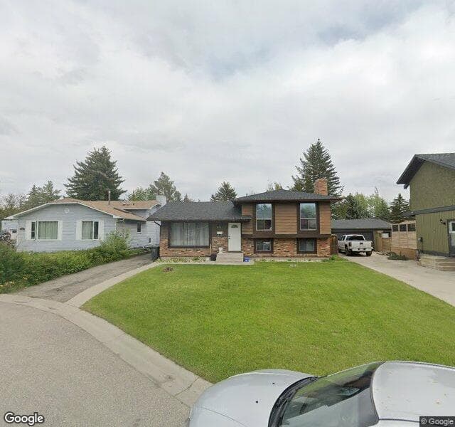 Street view of 211 Deer Side Place SE, Calgary