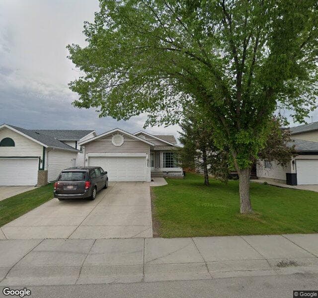 Street view of 584 Harvest Hills Drive NE, Calgary