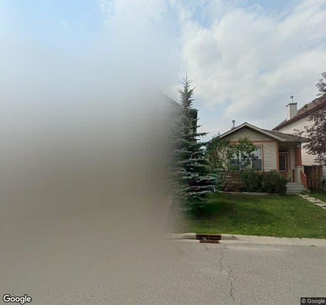 Street view of 94 Tuscany Ridge Common NW, Calgary
