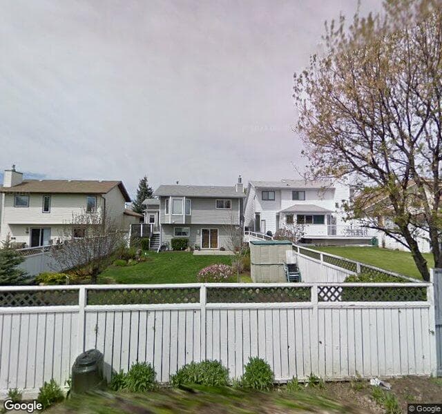 Street view of 80 Woodmark Crescent SW, Calgary
