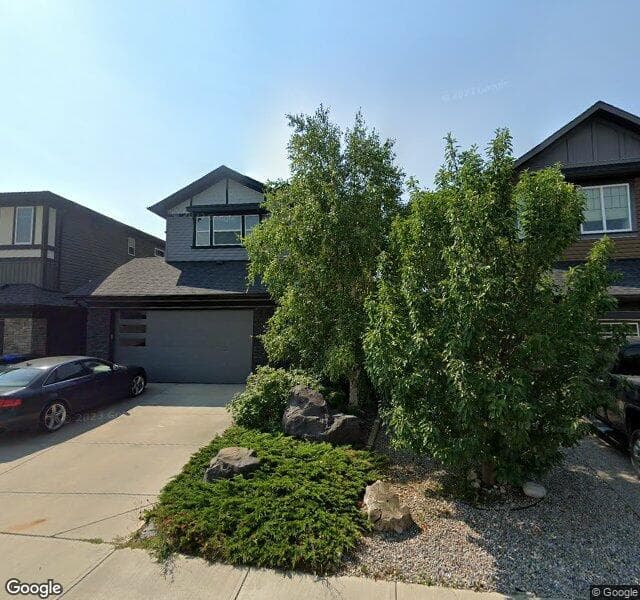 Street view of 25 Cougar Ridge Cove SW, Calgary