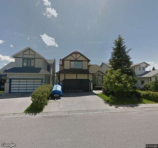 Street view of 143 Woodmark Crescent SW, Calgary