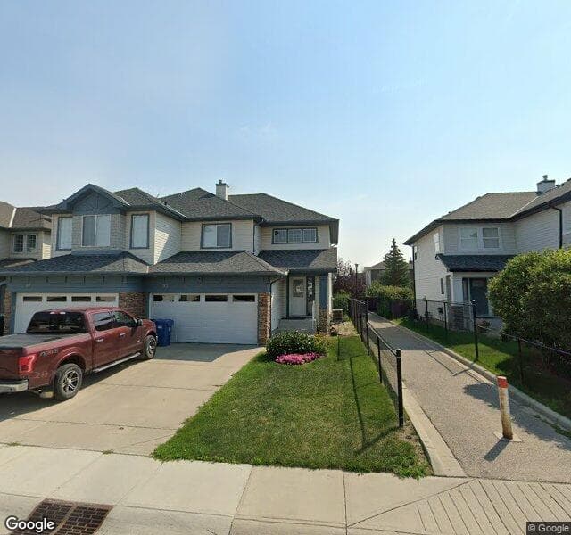 Street view of 93 Cougarstone Place SW, Calgary