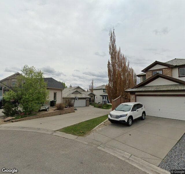 Street view of 315 Rocky Ridge Bay NW, Calgary