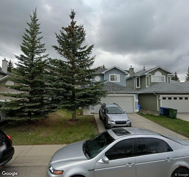 Street view of 32 Bridlewood View SW, Calgary
