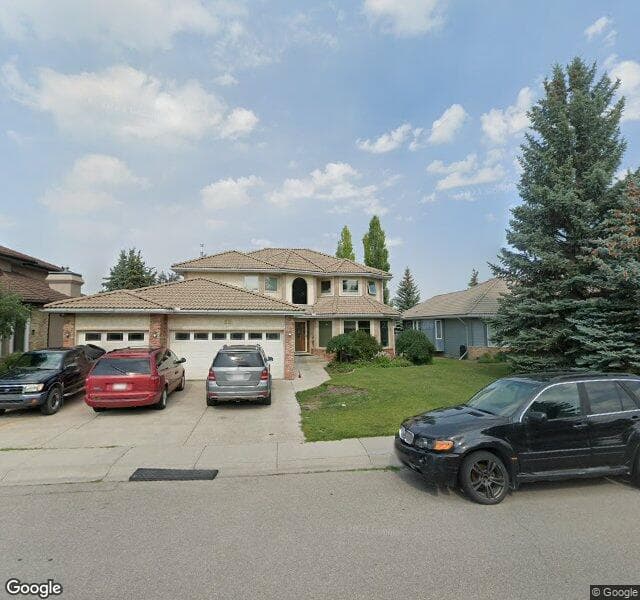Street view of 52 Woodpath Terrace SW, Calgary