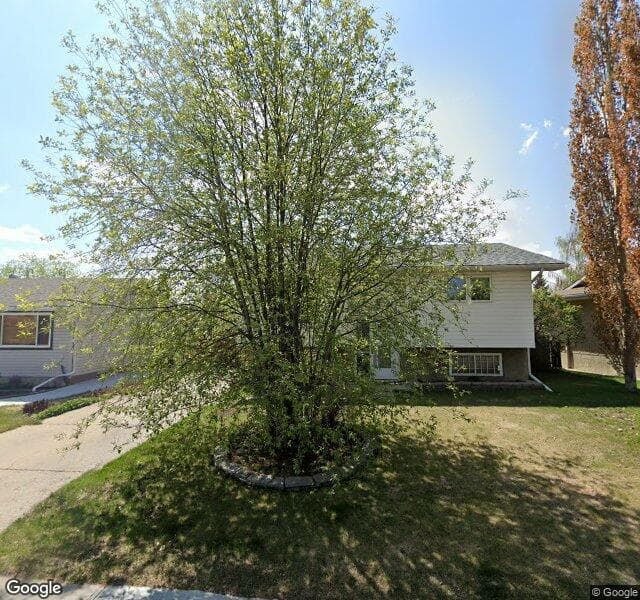 Street view of 7023 Huntridge Hill NE, Calgary