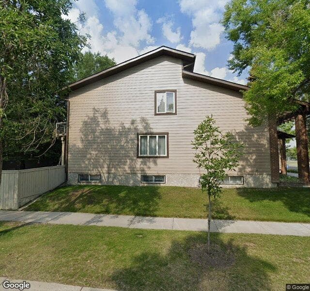 Street view of 63 Woodgreen Drive SW, Calgary