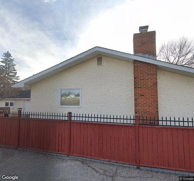 Street view of 1104 Lake Sylvan Drive SE, Calgary