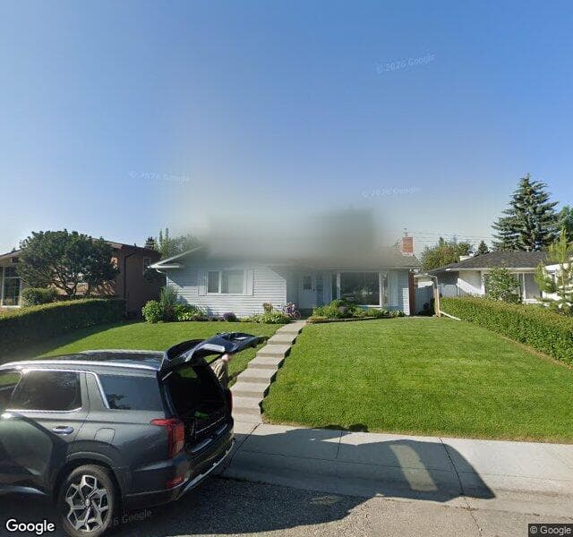 Street view of 819 Lake Emerald Place SE, Calgary