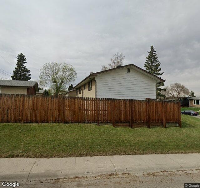 Street view of 1003 Huntercove Place NW, Calgary