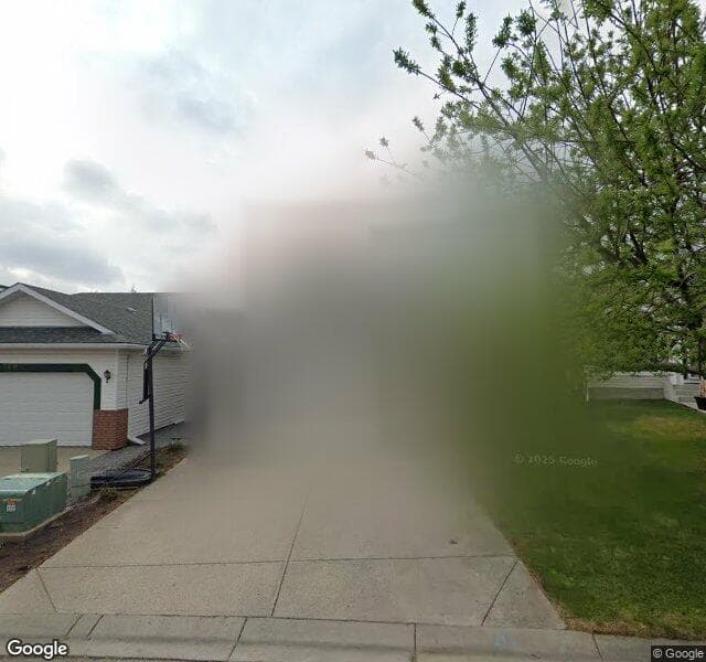 Street view of 125 Hidden Cove NW, Calgary