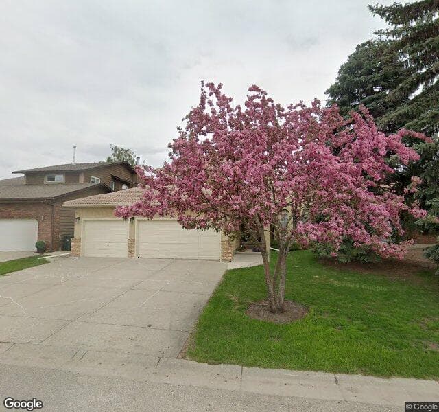 Street view of 100 Deerbrook Road SE, Calgary