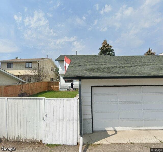 Street view of 92 Woodmont Drive SW, Calgary