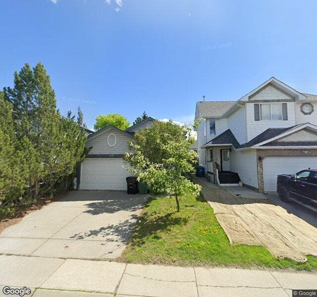 Street view of 99 Mount Apex Crescent SE, Calgary