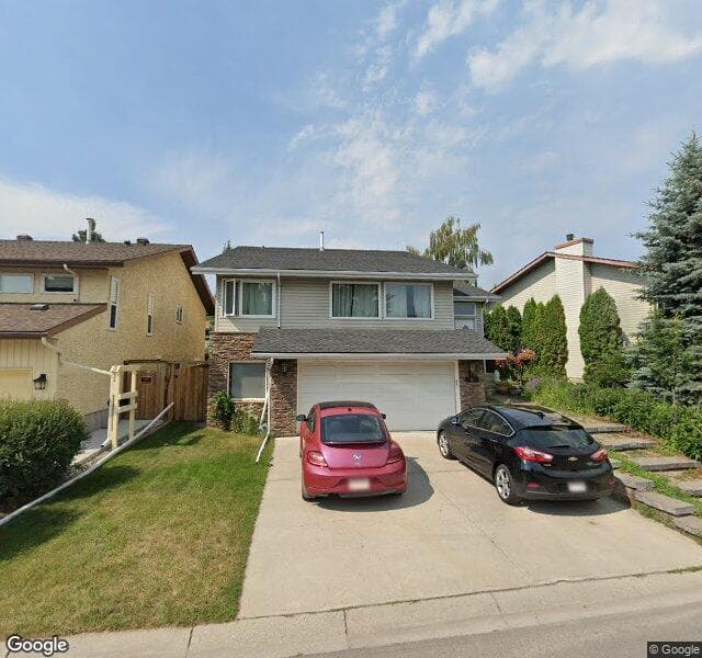 Street view of 91 Woodmont Drive SW, Calgary