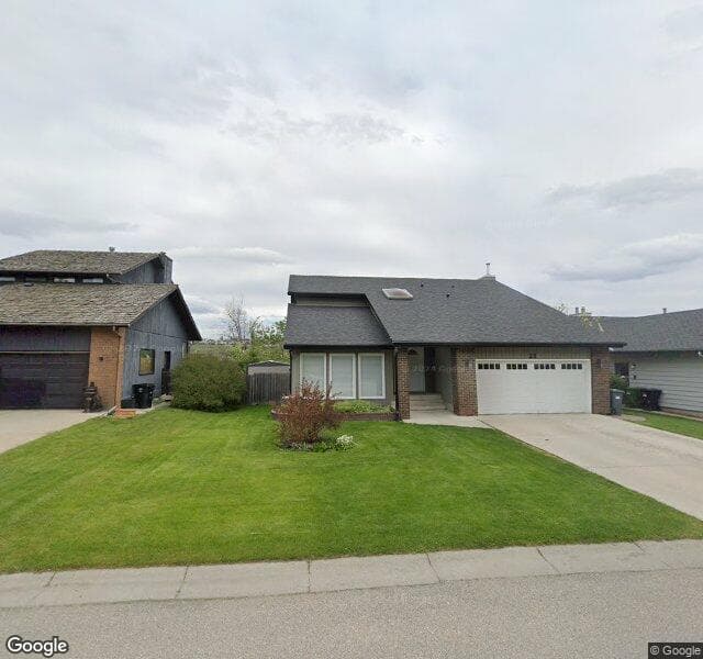 Street view of 32 Deerbrook Crescent SE, Calgary