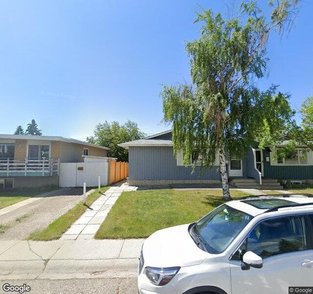 Street view of 100 Huntwick Way NE, Calgary